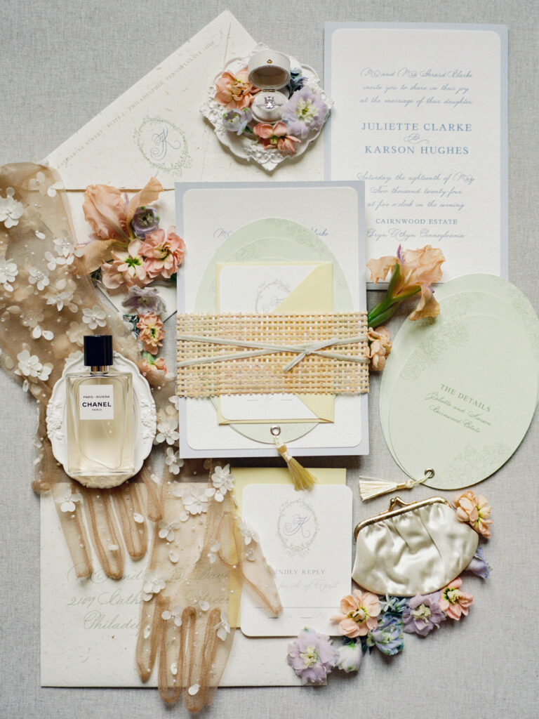 Flat lay of a custom wedding invitation suite designed for a luxury destination wedding celebration.