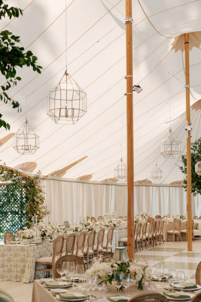 coastal-waterfront-tented-wedding-photos-18 Refined waterfront wedding design featuring plush seating, soft draping, and romantic coastal atmosphere