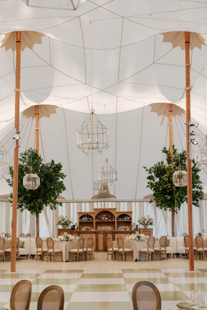 coastal-waterfront-tented-wedding-photos-19 Refined waterfront wedding design featuring plush seating, soft draping, and romantic coastal atmosphere